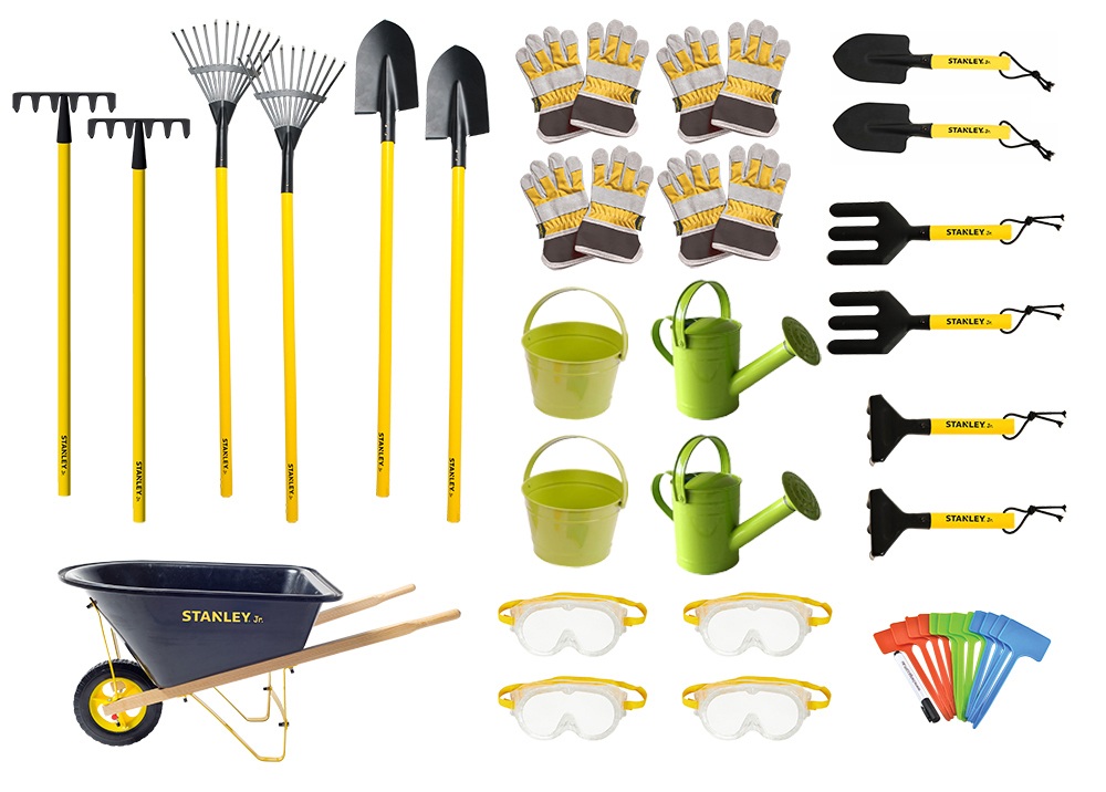 a selection of essential gardening tools including a trowel, fork and pruning shears laid out on a wooden surface